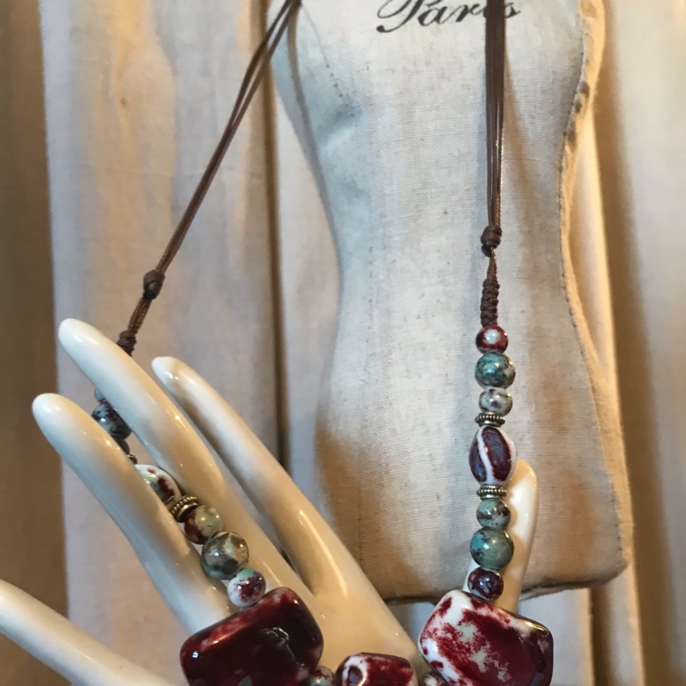 Nice necklace brownish red w turcoise beads!